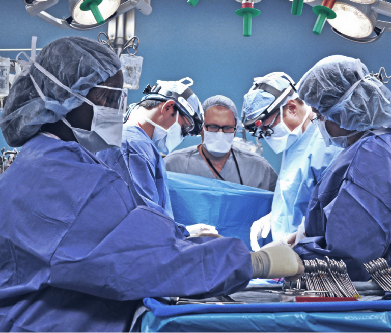 doctors working on patient in surgery