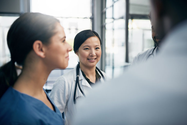 Shot of a diverse team of doctors having a discussion